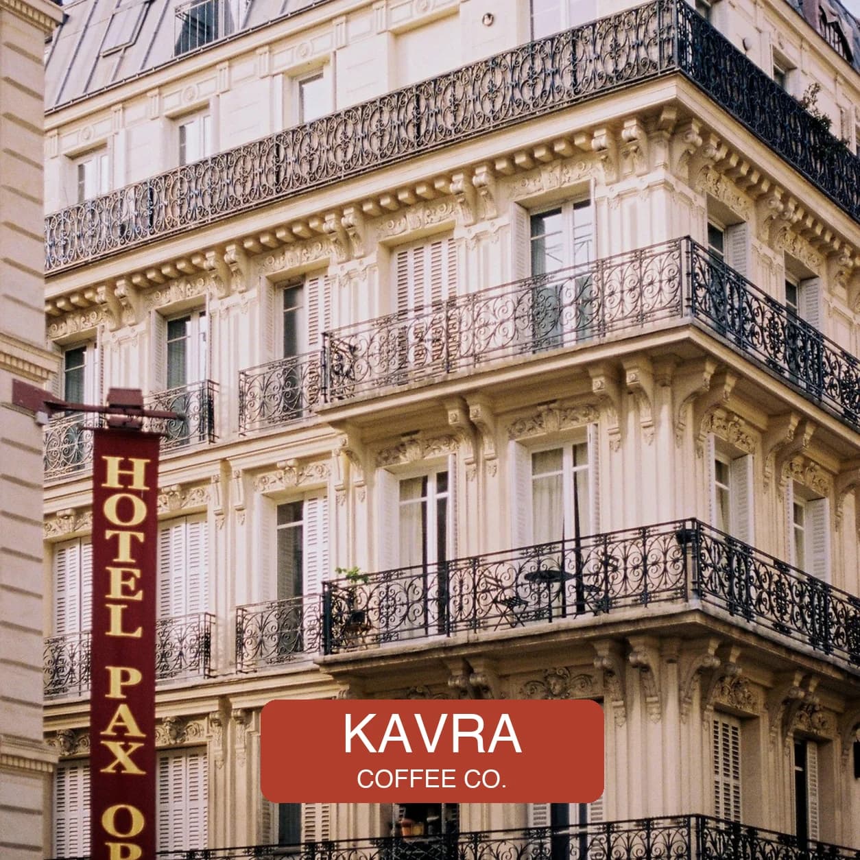 An architecture photo with a fictional KAVRA COFFEE brand badge across the lower area