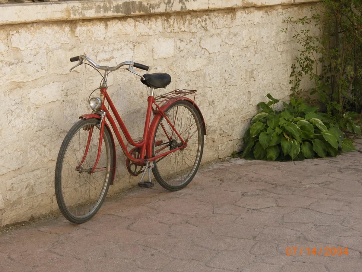 A red bicycle photo with an orange 07/14/2004 date stamp